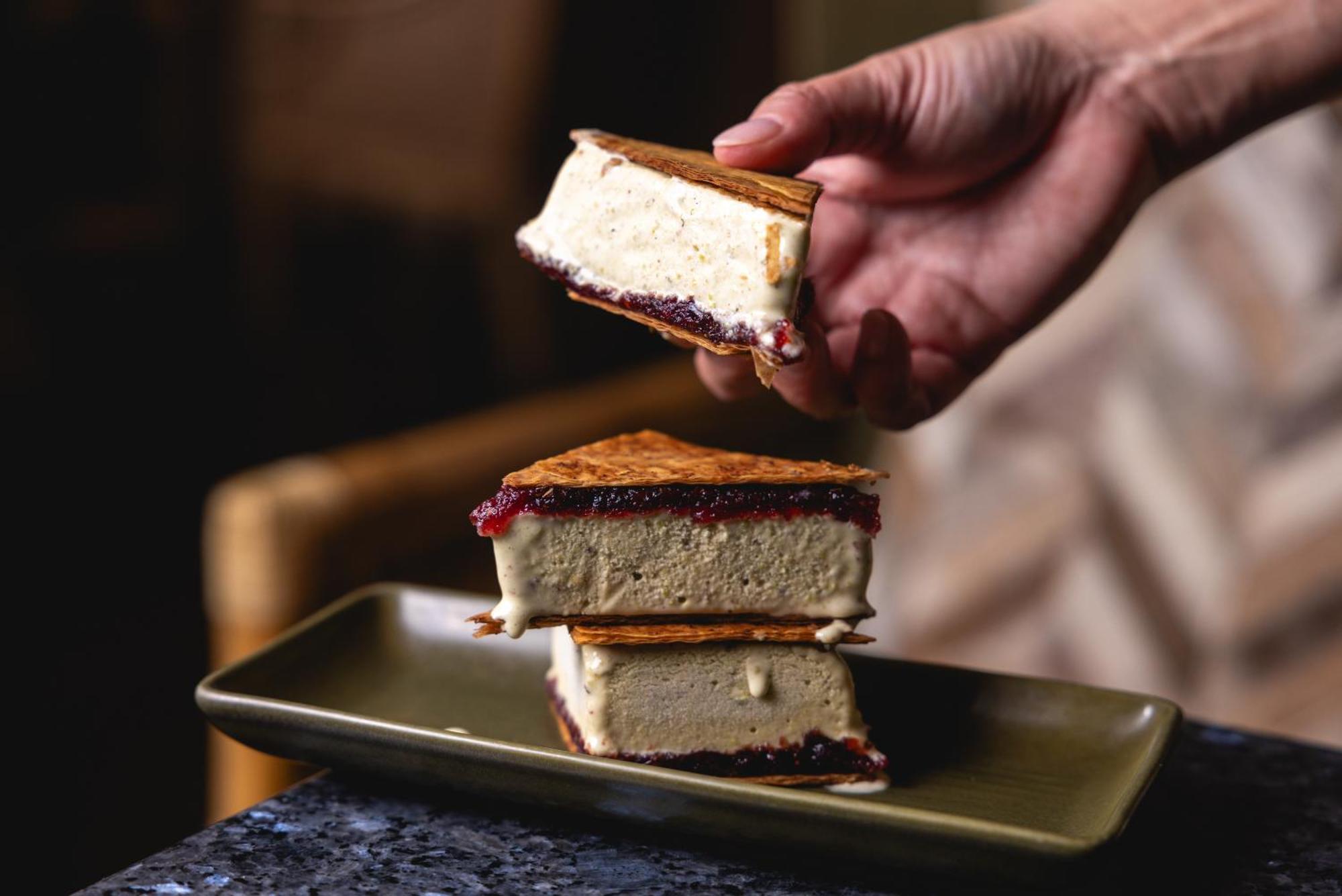 Ovolo The Valley Brisbane Eksteriør billede A hand holding a piece of ice cream sandwich